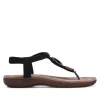 Sandalias planas Amarpies negras de dedo y cogidas al tobillo con detalles de madera
