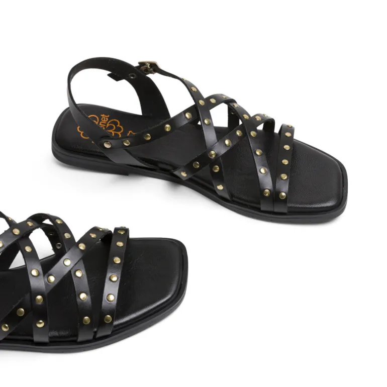 Sandalias planas Porronet victoria negras de piel con tiras cruzadas y tachuelas